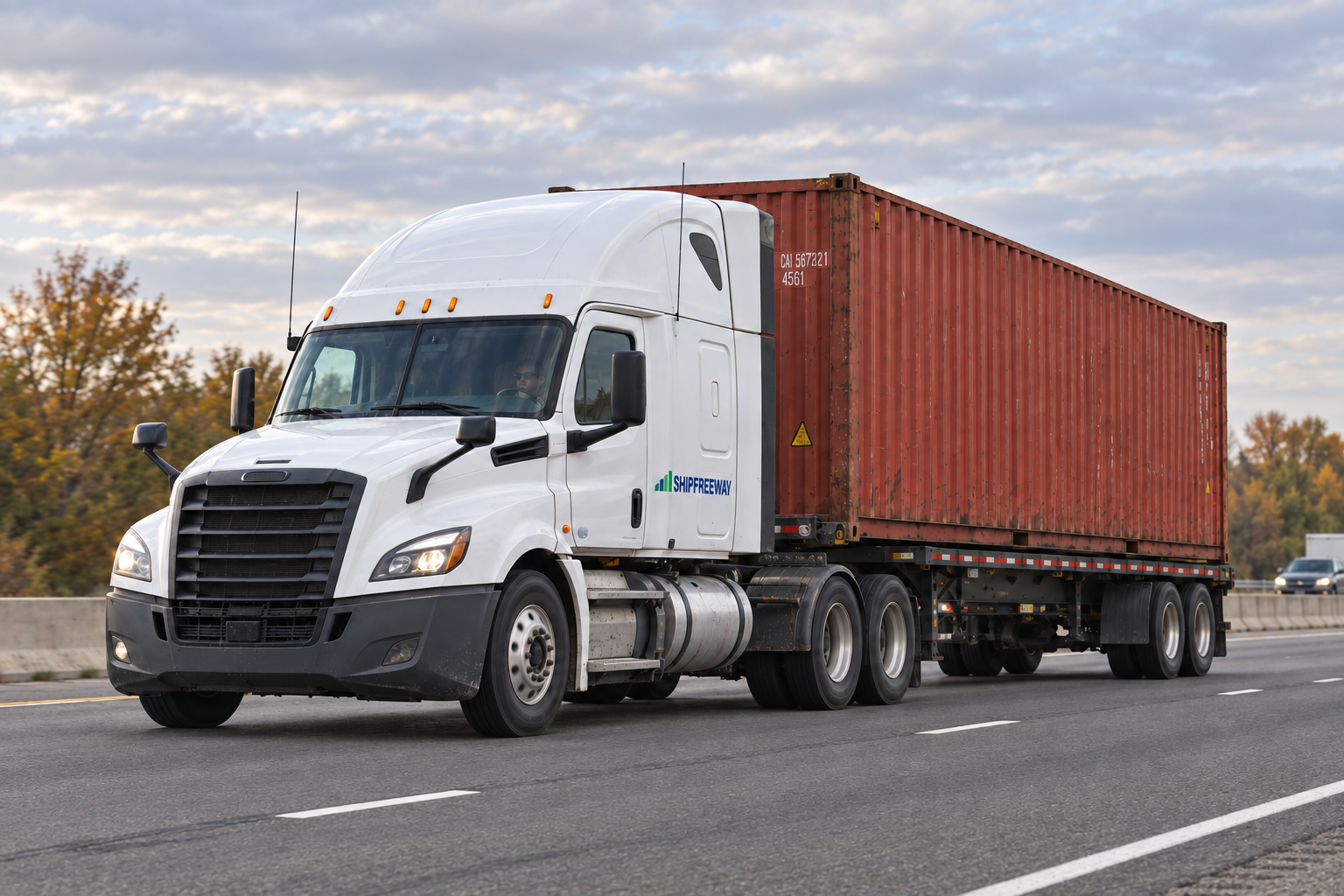 A haulage truck carrying a container